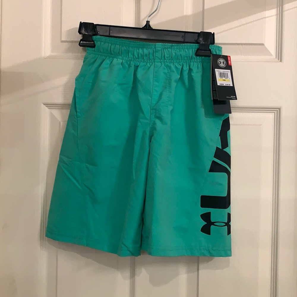 New with tags Under Armour  swim trunks size youth medium.